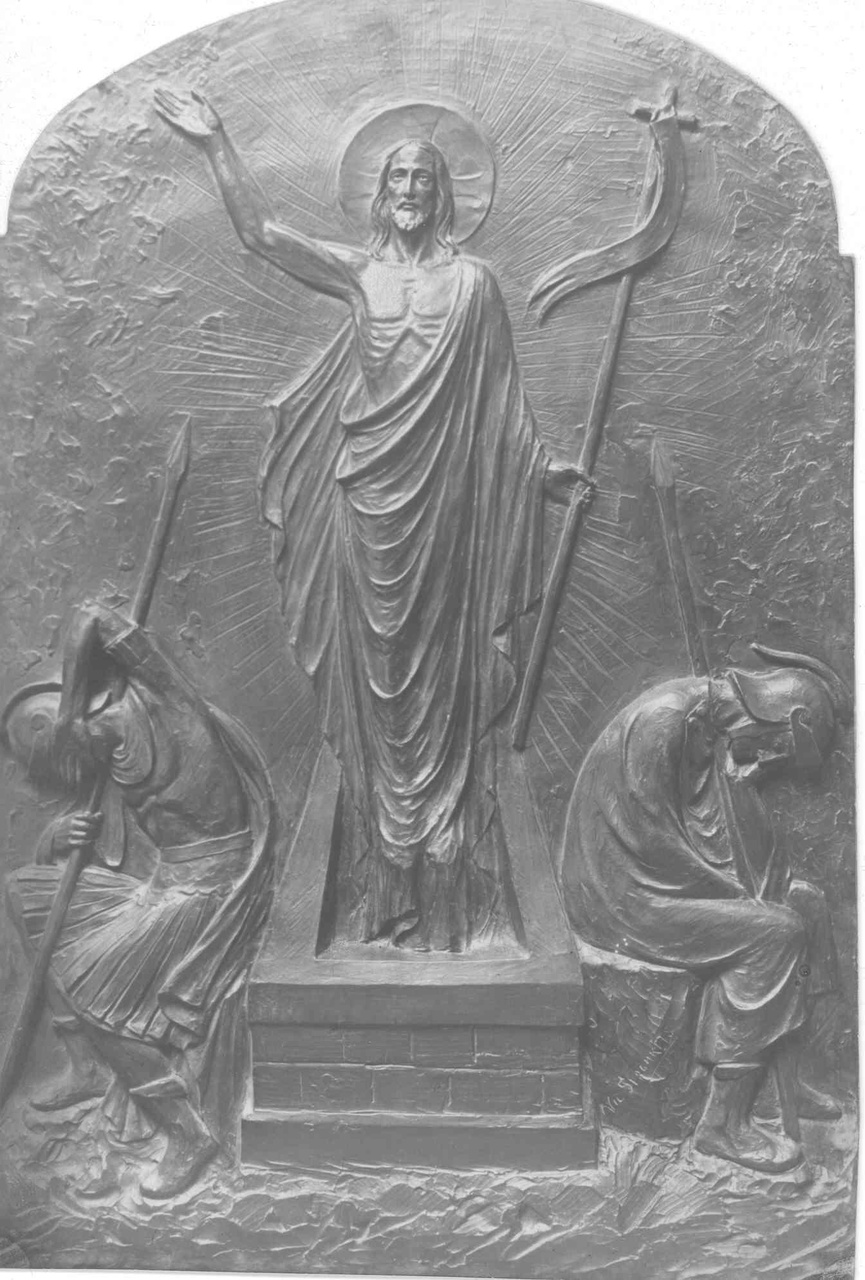 Foto van een bronzen plaquette, voorstellende een verrezen Christus